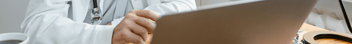 doctor physician at computer typing