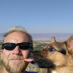 ingenious med's stephen besch outdoors with his dog